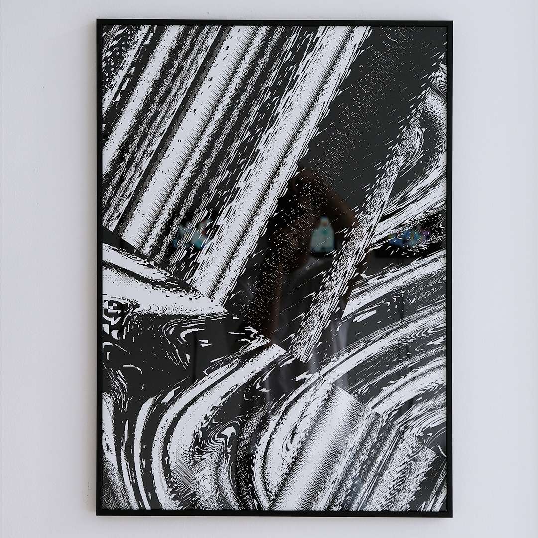 photograph of an abstract black & white print in a frame, 50x70cm